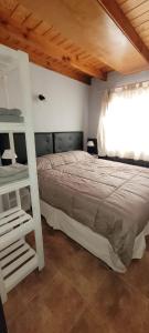 Ένα ή περισσότερα κρεβάτια σε δωμάτιο στο Blue House 3 Villa La Angostura