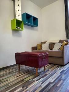 a living room with a couch and a coffee table at T2 centre village "Chez Clothilde" in Remoulins