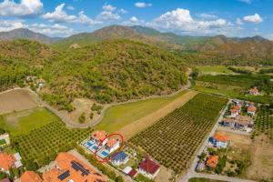 an aerial view of a farm with mountains in the background at Villa Sasha 1 in Ortaca