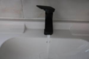 a black pole sitting on top of a white floor at Changsha Fuxiangyuan International Hostel in Changsha