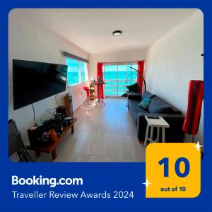 Μια τηλεόραση ή/και κέντρο ψυχαγωγίας στο Departamento frente al mar con cochera!