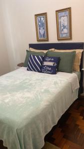 Łóżko lub łóżka w pokoju w obiekcie Apto aconchegante com 3 dormitorios bem localizado