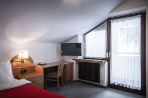 Postel nebo postele na pokoji v ubytování Hotel Mühlwald