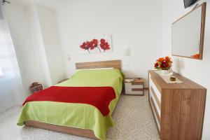 Un pat sau paturi într-o cameră la Casa Mammato