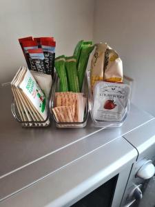 a counter top with a bunch of food on it at Cosy home in Stornoway