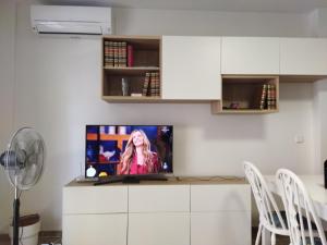 a living room with a flat screen tv on a counter at Apartment 1-1G Calle Antonion Millon in Nerja