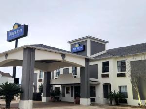 a hotel with a sign on top of it at Days Inn by Wyndham Lafayette Scott in Lafayette
