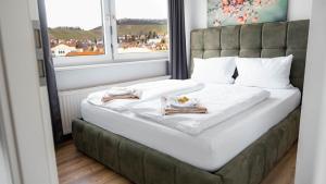 Postel nebo postele na pokoji v ubytování E&B Apartments Korb