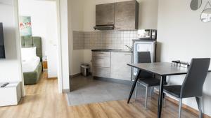 Kuchyň nebo kuchyňský kout v ubytování E&B Apartments Korb