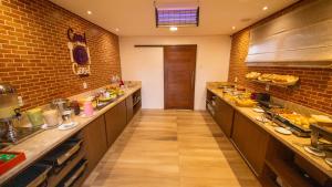 Kuchyň nebo kuchyňský kout v ubytování Diff Hotel - by Easy Hotéis