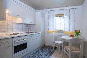 Kuchyň nebo kuchyňský kout v ubytování Ferienwohnung Stockinger