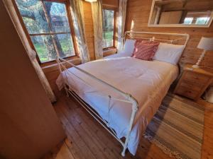 Postel nebo postele na pokoji v ubytování Cherry Orchard Retreat