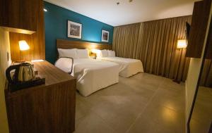 Postel nebo postele na pokoji v ubytování Diff Hotel - by Easy Hotéis