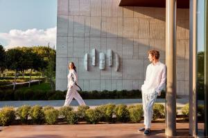 a man and a woman walking in front of a building at Bayou Villas-Ultra All Inclusive in Antalya