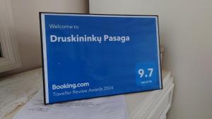 a sign that is sitting on top of a table at Druskininkų Pasaga in Druskininkai