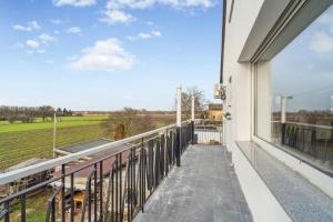 a balcony with a view of a field at SU01 Wohnung in Klein-Gerau! in Büttelborn