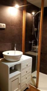 a bathroom with a sink and a shower at L'Ancre du Bessin - Proximité Bayeux et plages du débarquement - D-DAY - Spa en option - Accessible PMR in Saint-Vigor-le-Grand