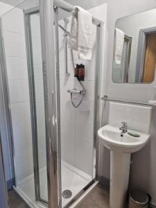 a bathroom with a shower and a sink at The Star in West Leake