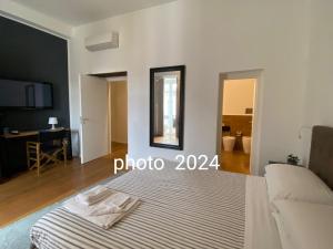A bed or beds in a room at Vicolo dei Sartori