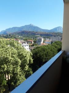 a view of the city from the balcony at L'INSO GAMBETTA in Chambéry