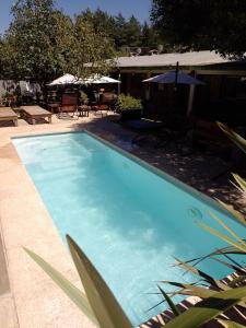 Het zwembad bij of vlak bij Complejo Los Gringos