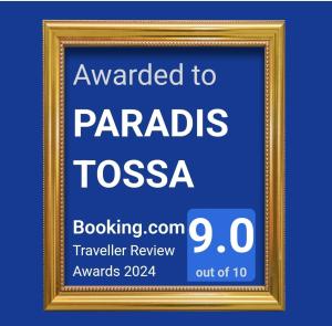 a framed sign that reads awarded to paragogias toscasia at PARADIS TOSSA in Tossa de Mar