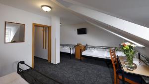 Ένα ή περισσότερα κρεβάτια σε δωμάτιο στο Hotel Boston