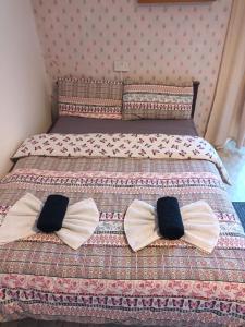 two bow ties on a bed in a bedroom at Presentation Convent in Mooncoin
