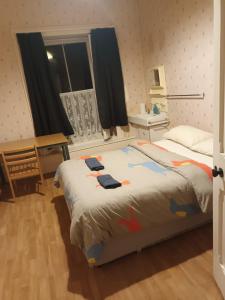 a bedroom with a large bed and a window at Presentation Convent in Mooncoin