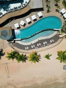 an overhead view of a swimming pool at a resort at Palm Beach Resort & Spa in Ambondrona