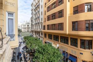 a view of a street in a city with buildings at Pensión Alicante by Moontels in Valencia