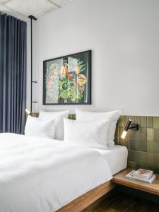 Postel nebo postele na pokoji v ubytování URBAN LOFT Berlin