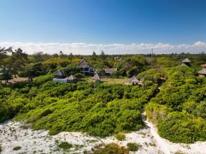 an aerial view of a resort with a river at Bamba Kofi Tented Camp in Watamu