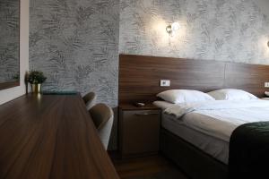 Postel nebo postele na pokoji v ubytování Hotel Garden