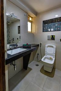 a bathroom with a sink and a toilet at Matra Chaya in Jodhpur