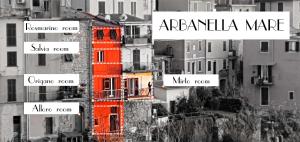 a group of buildings with names on them at Arbanella in Corniglia