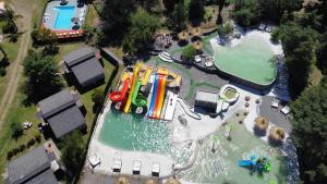 an aerial view of a water park with a roller coaster at Capri Hotel y Cabañas by CPH in Villa Carlos Paz