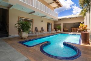 a swimming pool in the middle of a house at Pousada Meia Ponte in Pirenópolis +32 photos