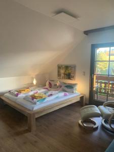 a bedroom with a bed and a window at Ferienwohnung mit großem Balkon und Blick in den Taunus in Oberems