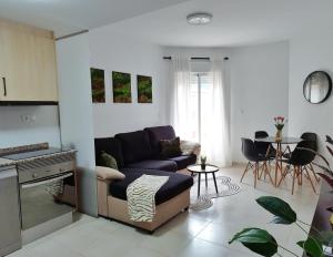 a living room with a couch and a table at Cozy apartment in Castalla in Castalla