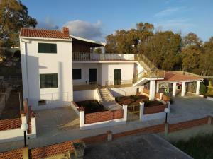 an aerial view of a white house at Giusi's House in Cava dʼAliga +8 photos