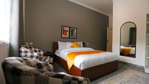 Säng eller sängar i ett rum på Destination Hotel Thandiani