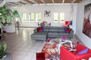 
a living room filled with furniture and a couch at Le Loft De La Robine in Narbonne
