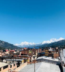a view of a city with mountains in the background at Gran Hotel Alturas in Huaraz