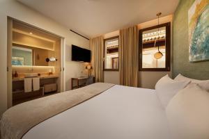 a hotel room with a bed and a bathroom at Sant Jaume Design Hotel in Palma de Mallorca