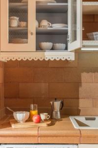 a kitchen counter with some food on a cutting board at Villa Areal Porto Santo - By An Island Apart in Porto Santo