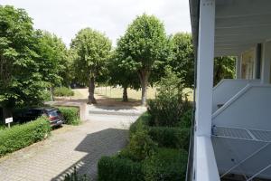 a view of a driveway from a house with a car at Villa Parkblick App. 4 in Kühlungsborn