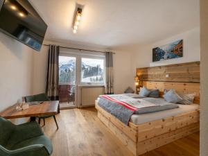 A bed or beds in a room at Berghof Haselsberger