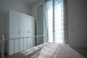 Postel nebo postele na pokoji v ubytování CA' DEL RE SCARTOZZ