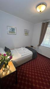 Ένα ή περισσότερα κρεβάτια σε δωμάτιο στο Hotel Boston